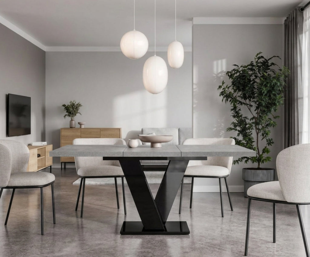 Concrete effect extending dining table with black gloss base in an open-plan living room