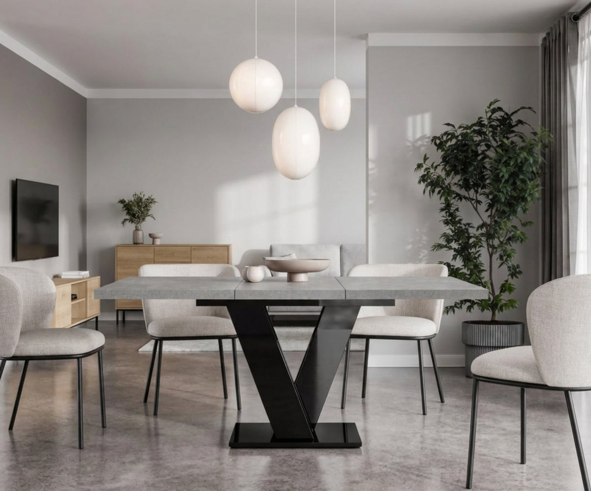 Concrete effect extending dining table with black gloss base in an open-plan living room