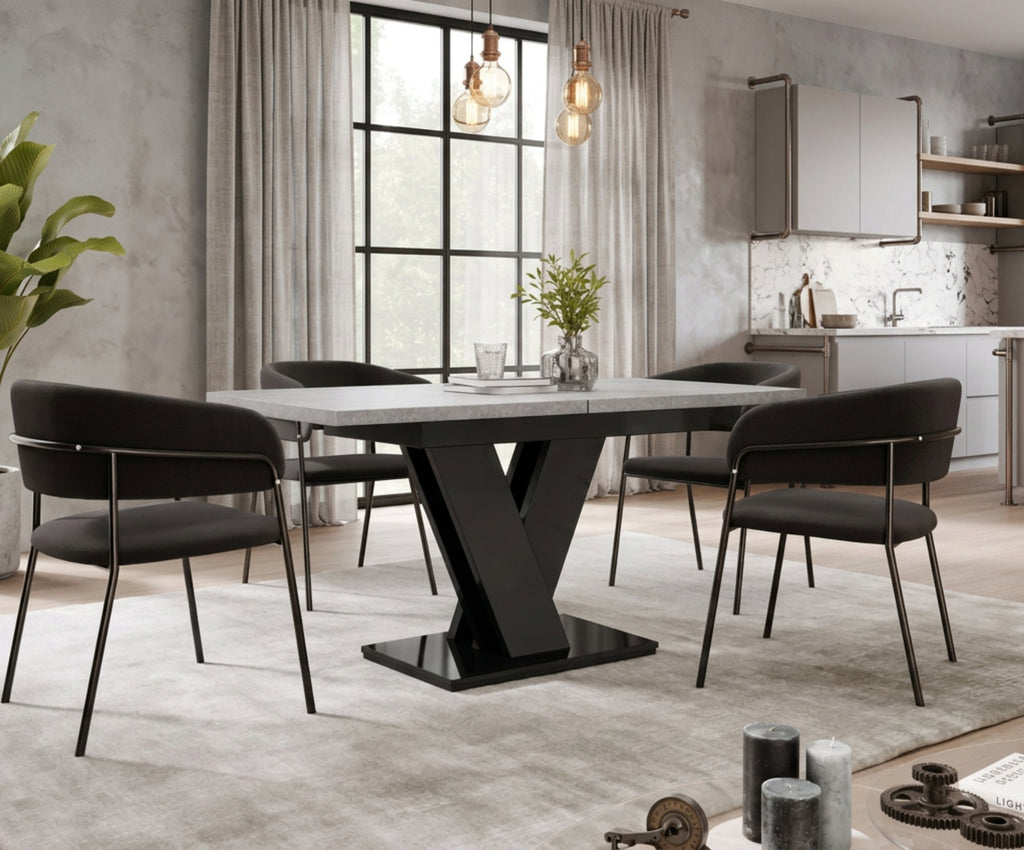 Grey and black gloss 120-160 cm dining table with black chairs in an industrial-style dining room