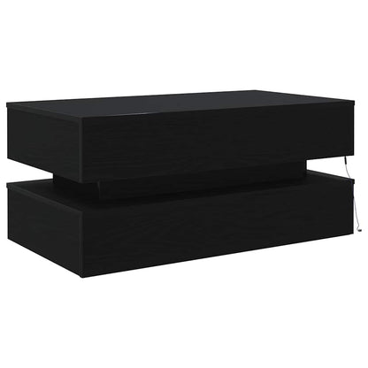 Sleek black coffee table with two-tier construction and concealed LED strip, offering a modern and elegant look.