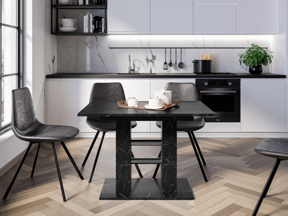 Modern extending dining table in a contemporary kitchen, featuring a black marble effect tabletop