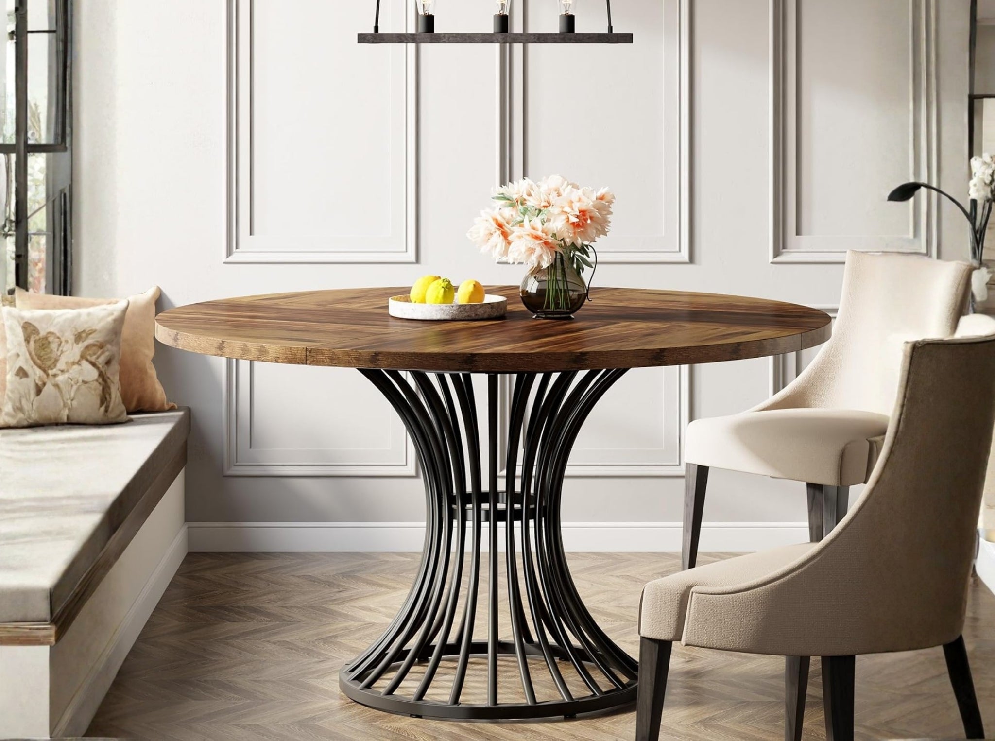Round dining table with natural wood top and black metal pedestal base near window, modern kitchen table for small spaces