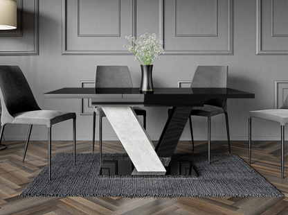 Dining room with a black dining table and chairs in a modern interior setting.