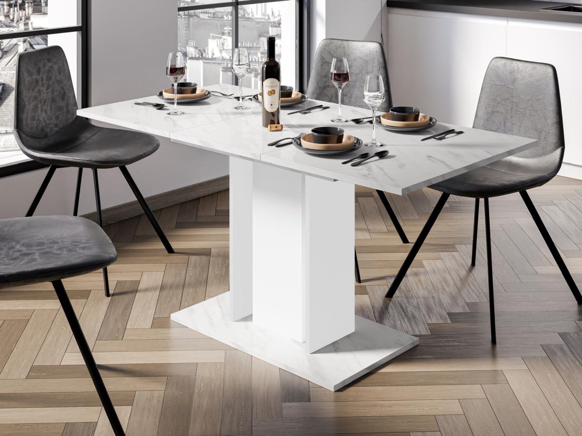 Extendable dining table with White Bianco Marble Effect tabletop, white central column and marble effect side columns, styled with chairs
