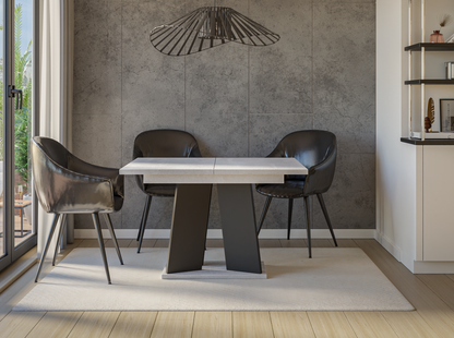 Luxury extendable dining table 120 cm with concrete-look top and black pedestal support.