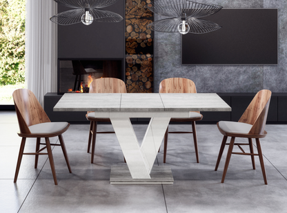 Modern extendable dining table with grey concrete top and glossy white base.