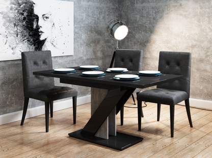 Modern extendable dining table with glossy black top and industrial concrete effect stand.