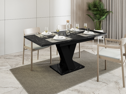 Extendable MASIV dinner table in black royal marble with solid black base.