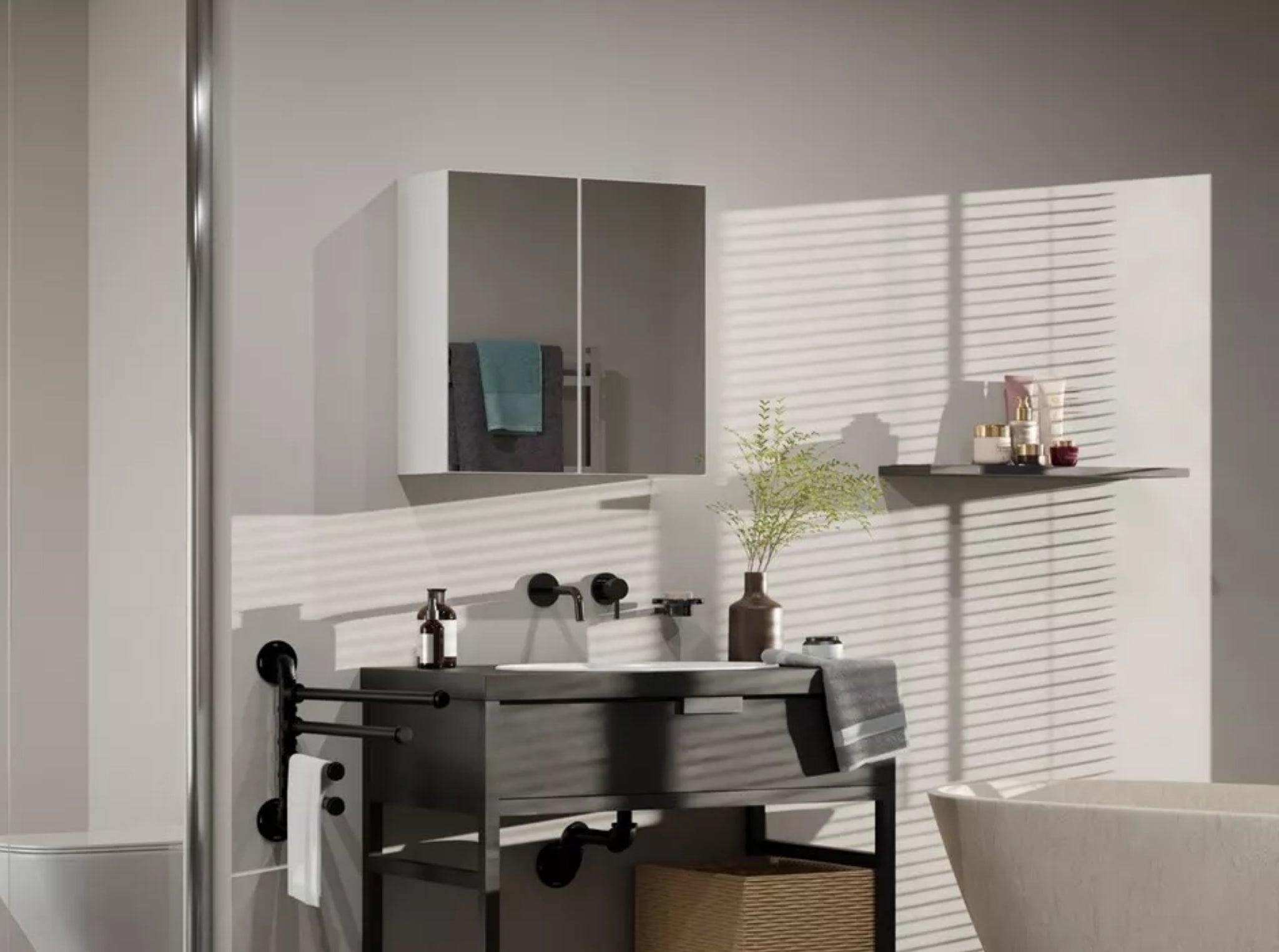 White wall mounted bathroom mirror cabinet above basin in modern bathroom interior, space saving storage solution