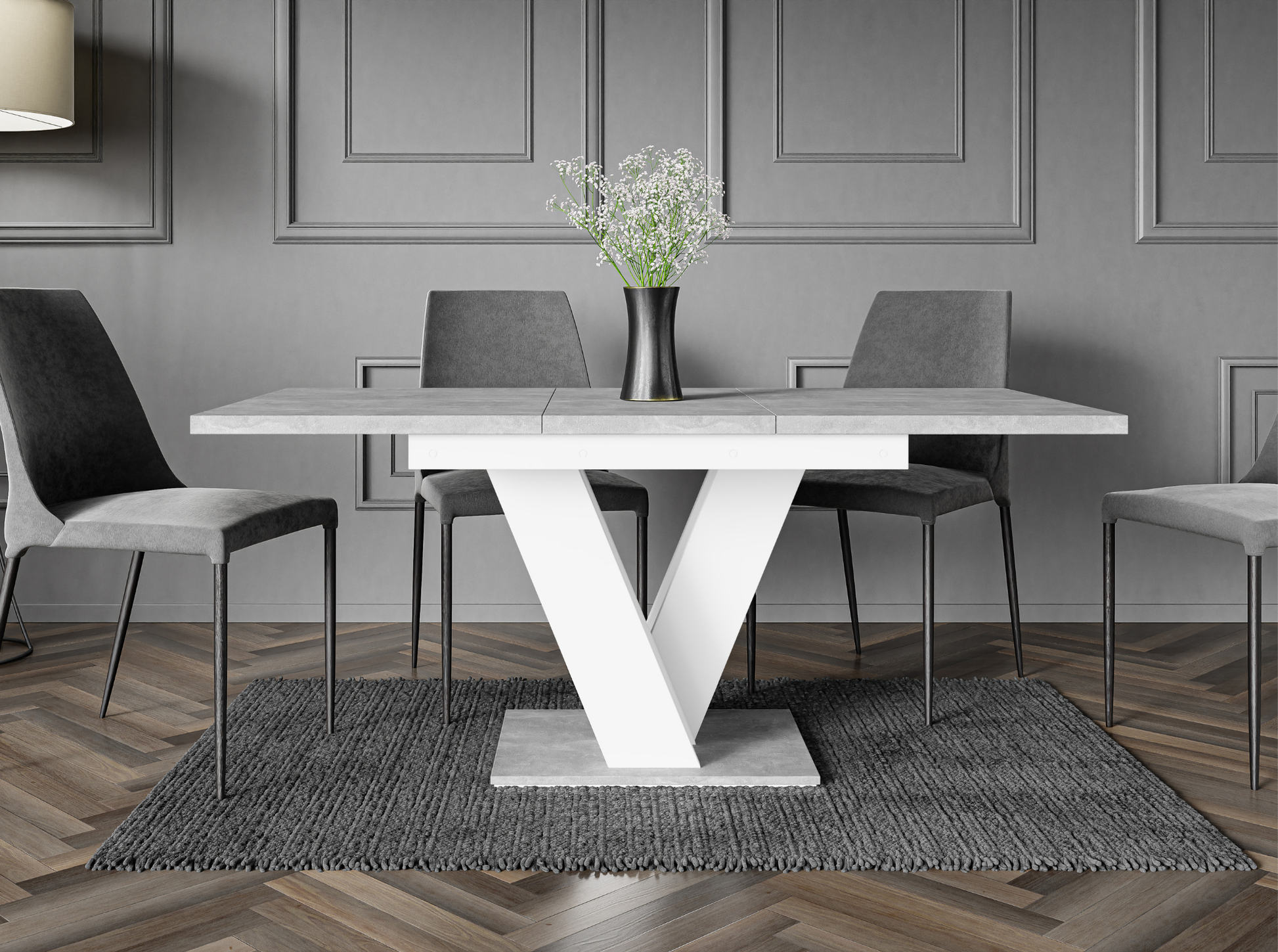Modern dining table with concrete effect surface and neutral white structure.