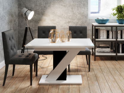 Stylish MAVEA dining table 120–160 cm with glossy black and white V-shaped stand.