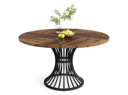 Round dining table with solid wood top and black metal pedestal base isolated on white background, modern kitchen table