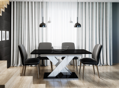 Modern black gloss dining table with contrasting white and black X-shaped base.