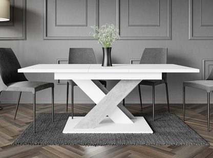 Modern dining table in white with contrasting concrete effect X-shaped stand.