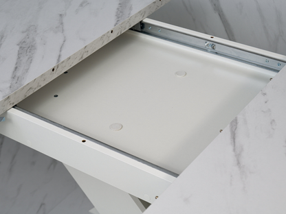 Detail of the extension system beneath the White Bianco marble effect tabletop of the dining table