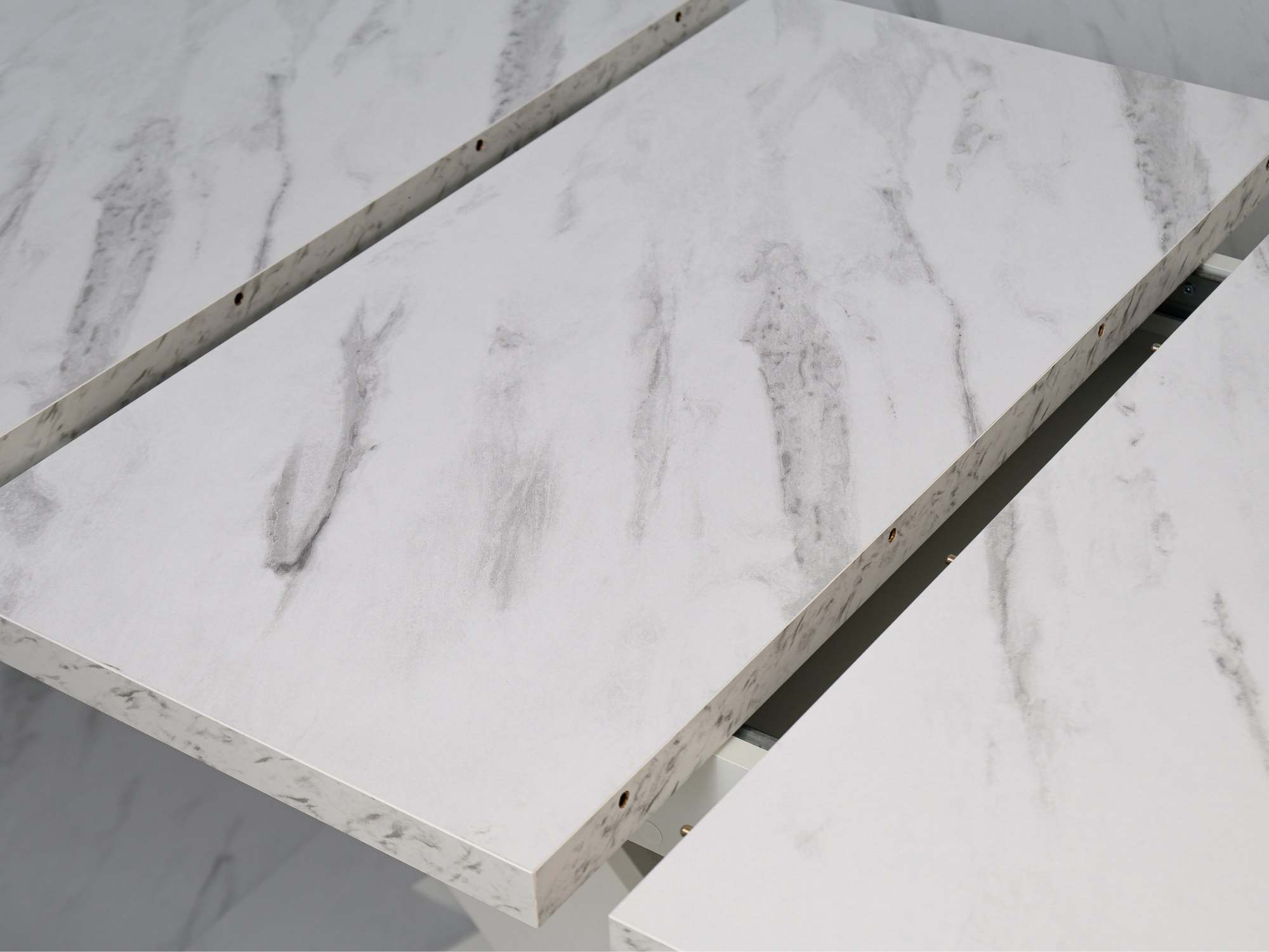 Close-up of White Bianco Marble Effect tabletop showing elegant veining and smooth finish