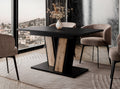 Muss extending dining table placed in a modern dining room setting, black tabletop with wotan oak effect base, surrounded by upholstered chairs and positioned on a decorative rug.