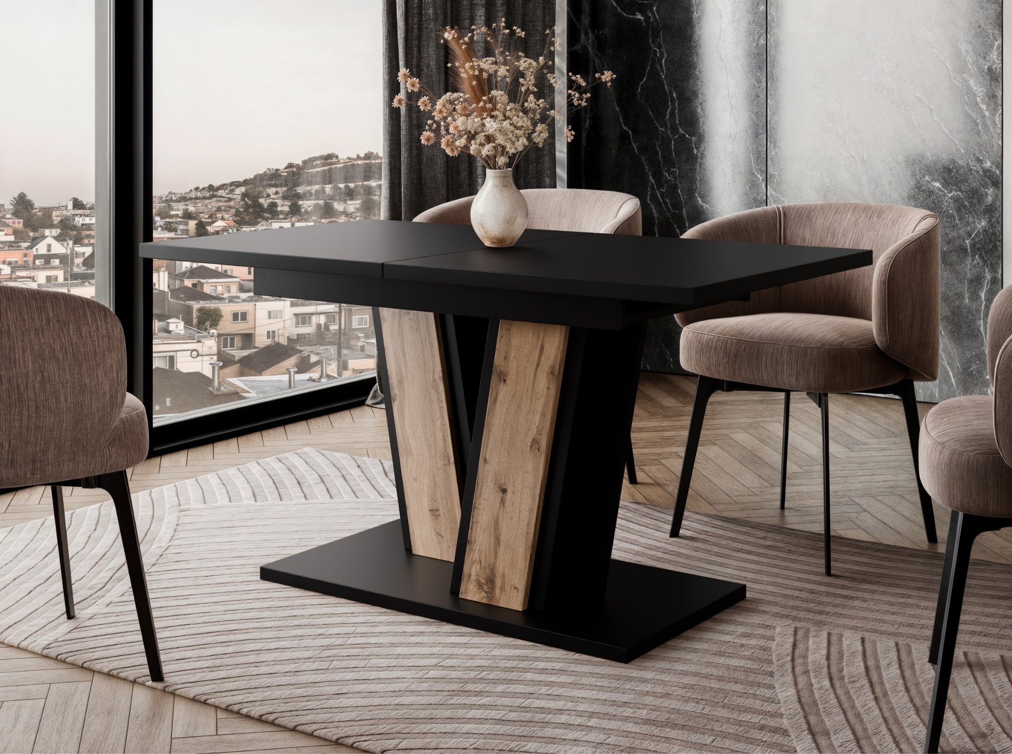 Muss extending dining table placed in a modern dining room setting, black tabletop with wotan oak effect base, surrounded by upholstered chairs and positioned on a decorative rug.