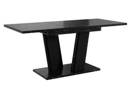 Contemporary dining table Muss with a black marble look tabletop and solid black pedestal base in a V-shaped design, compact extending table suitable for modern kitchens and dining rooms.