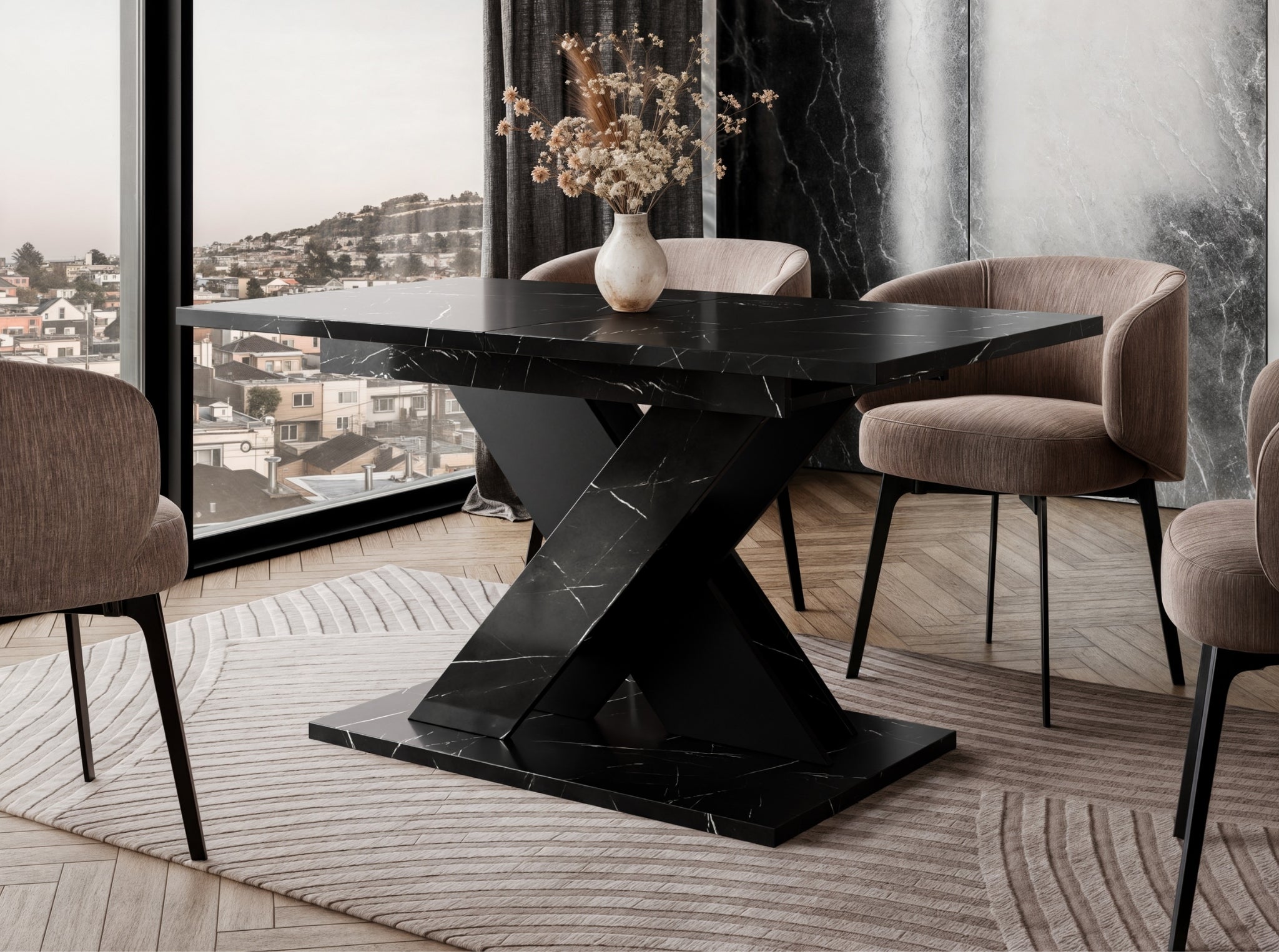 TOXX extending dining table with a black royal marble effect finish placed in a modern dining room setting, black X-shaped pedestal base, upholstered dining chairs arranged around the table on a rug.