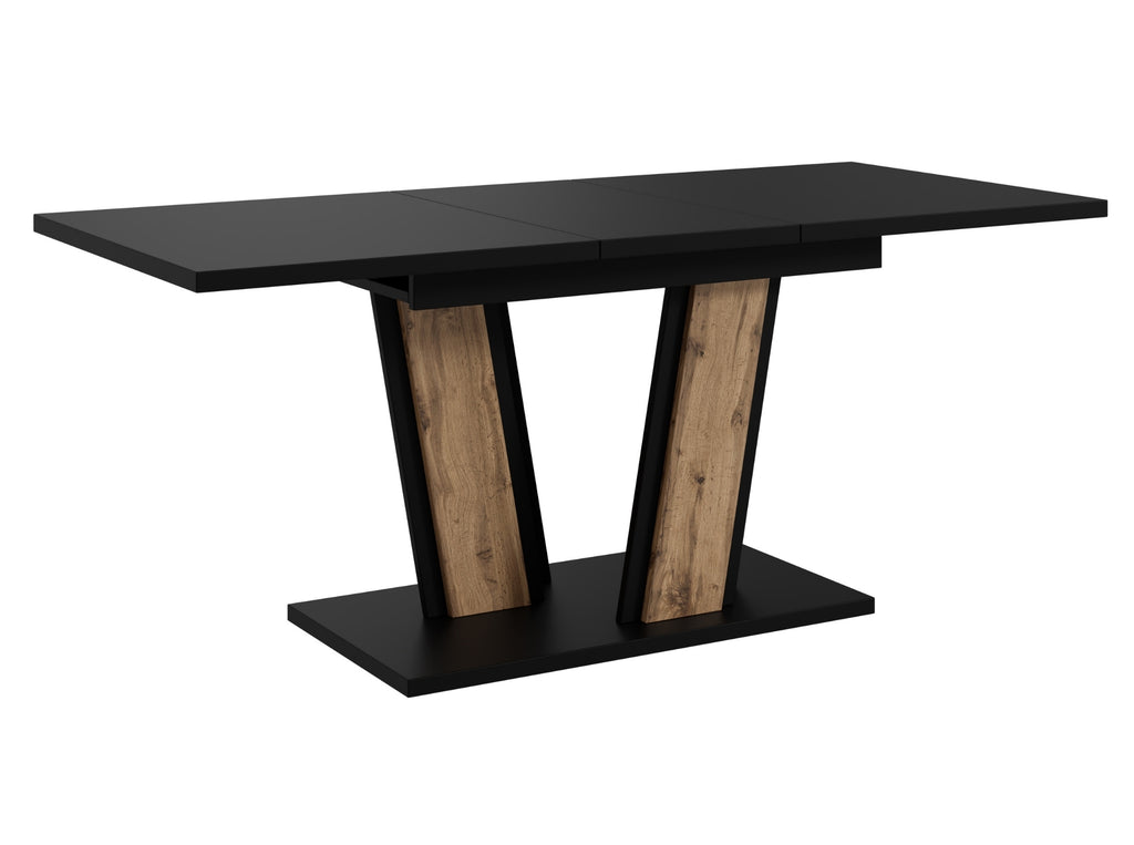Contemporary dining table Muss featuring a matte black tabletop and a pedestal base with wotan oak effect panels and black frame, compact extending design ideal for modern interiors.