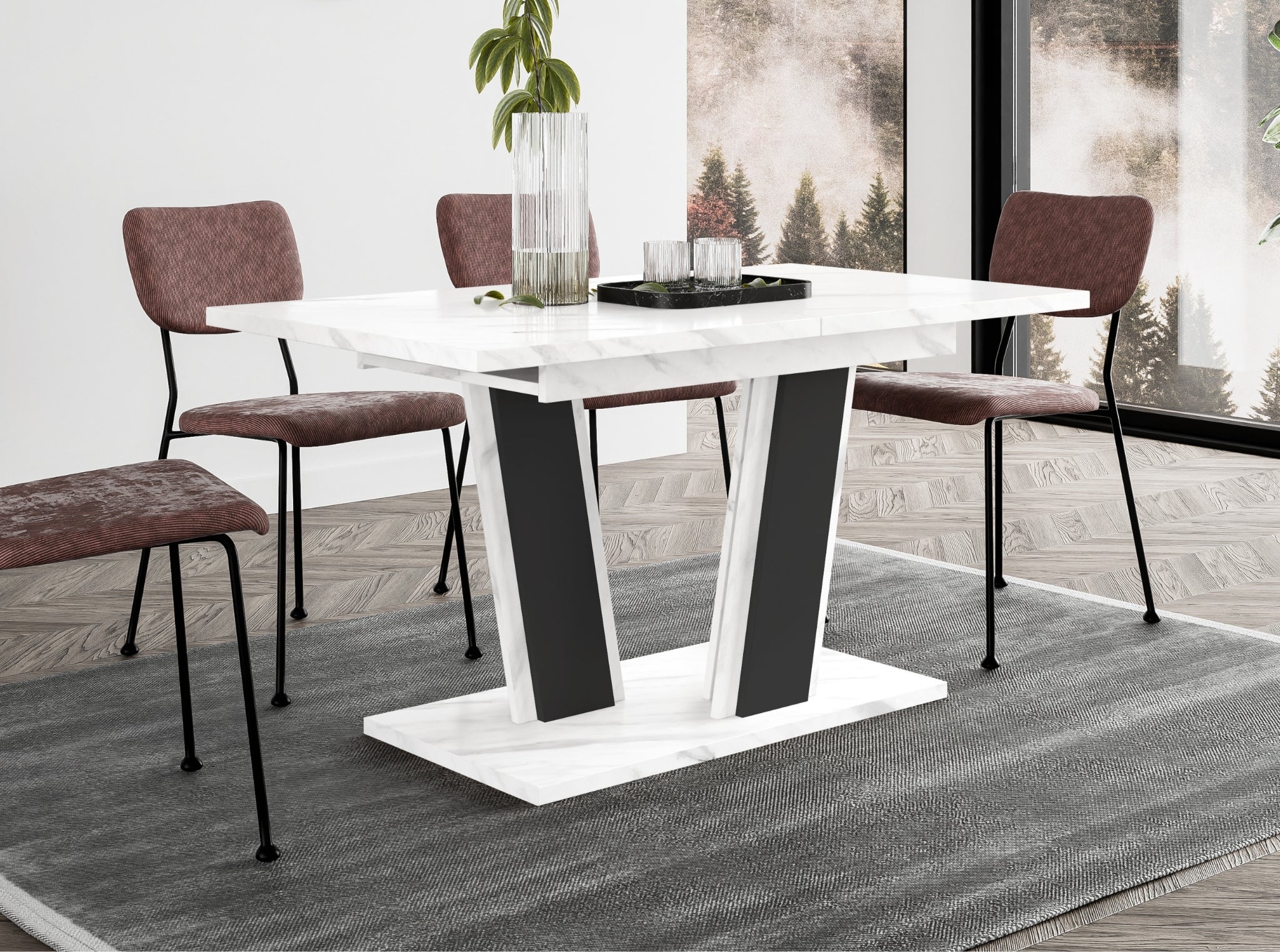 Contemporary dining table Muss featuring a white marble look tabletop and solid black pedestal base, extending design suitable for modern kitchens and dining rooms, compact size for everyday family use.