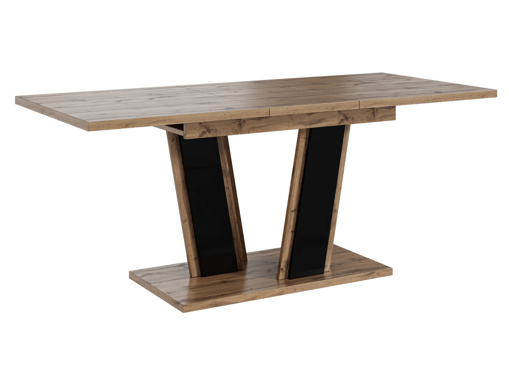 Contemporary dining table Muss with a natural wotan oak effect tabletop and contrasting black gloss pedestal base, compact extending design suitable for modern kitchens and dining rooms.