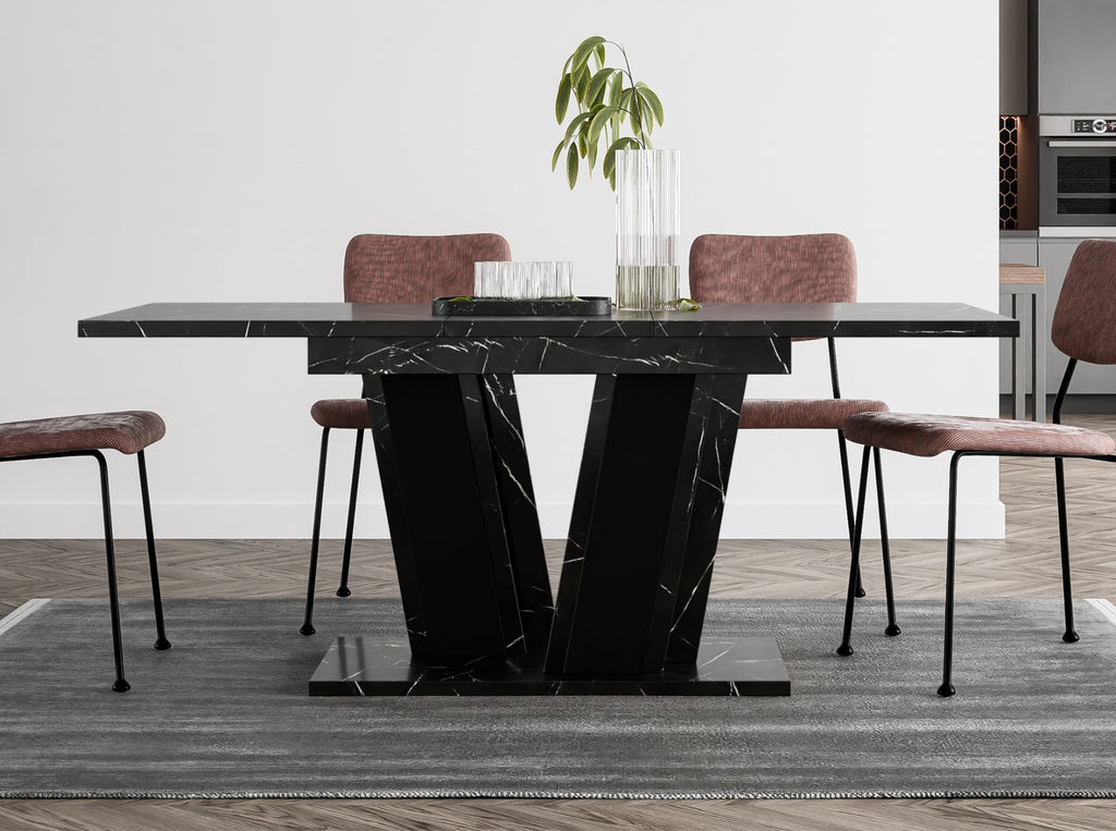 Space-saving extending dining table Muss with black marble effect rectangular tabletop and black base, compact design measuring 120–160 cm in length, suitable for modern interiors and smaller dining rooms.