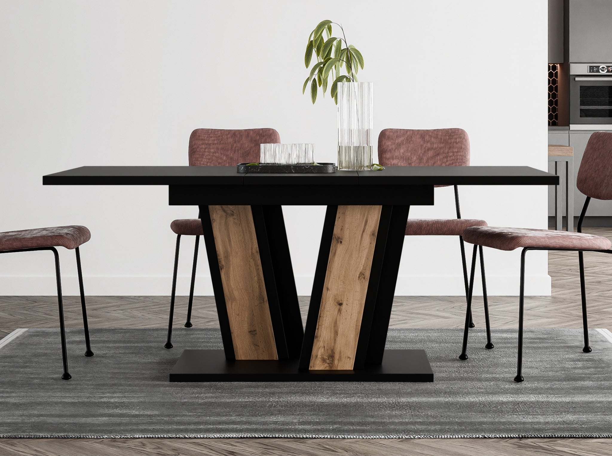 Space-saving extending dining table Muss with black tabletop and wotan oak effect pedestal base, compact design extending from 120 to 160 cm, suitable for smaller modern interiors.