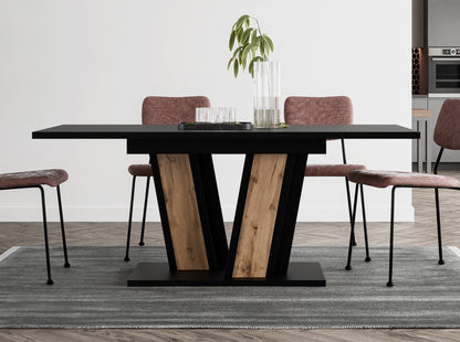 Space-saving extending dining table Muss with black tabletop and wotan oak effect pedestal base, compact design extending from 120 to 160 cm, suitable for smaller modern interiors.