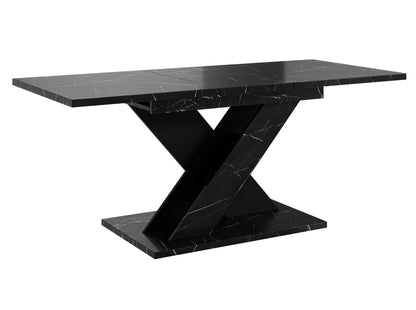 Contemporary dining table TOXX with a black royal marble look tabletop and sturdy black pedestal base in a distinctive X-shaped design, compact extending table suitable for modern dining rooms and kitchens.